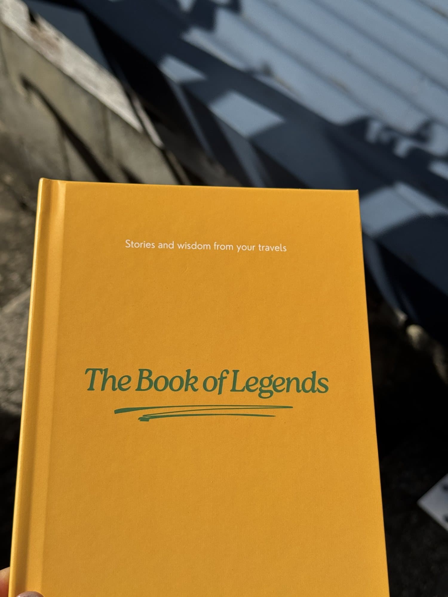 The Book of Legends in hand in the late afternoon light